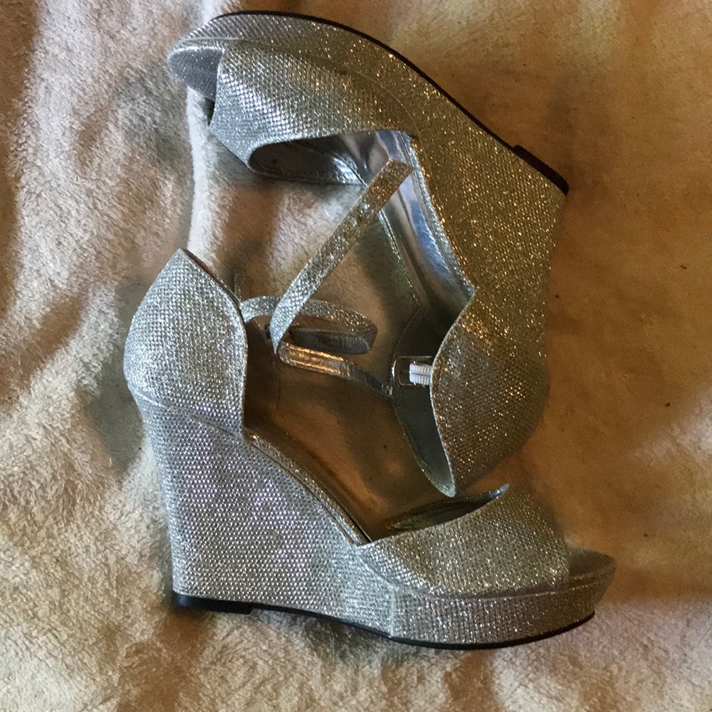 These are silver sparkling wedged heels.
